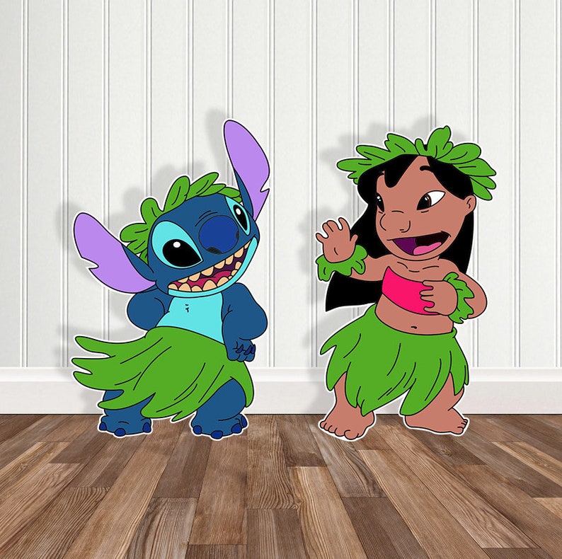 May include: Two cartoon characters, Stitch and Lilo, from the Disney movie Lilo & Stitch. Stitch is blue with purple ears and is wearing a green grass skirt. Lilo is brown with black hair and is wearing a green grass skirt and a pink top.