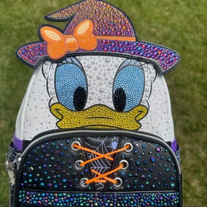 daisy duck loungefly mini backpack EXCLUSIVE DROP: Steampunk Take your stuff with you with this colorful nylon backpack by WondaPop featuring Disneys Daisy Duck loungefly" | Hot Topic |