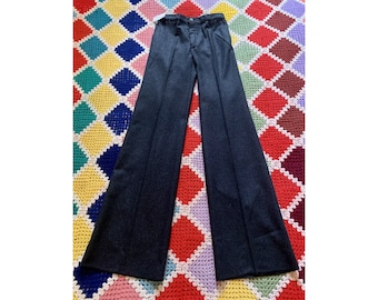 May include: A pair of dark gray wide-leg pants with a straight leg and a high waist.