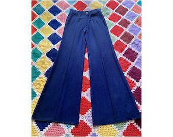 May include: A pair of wide-leg, navy blue pants with a high waist and a straight leg.
