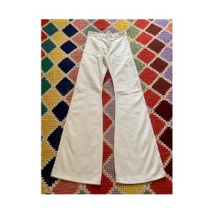 70s DEADSTOCK WHITE woman FLARED jeans (size 27x36)