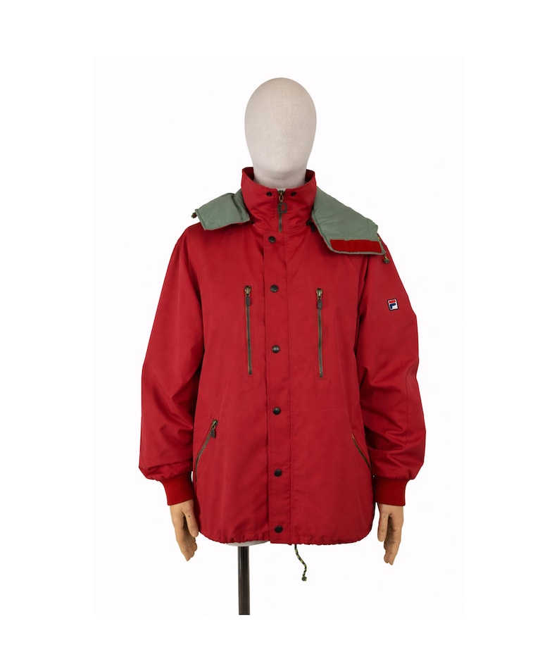 May include: A set of three ceramic mugs with a speckled, matte finish. The mugs are in shades of cream, light gray, and dark gray. Each mug has a simple, minimalist design and a rounded handle.