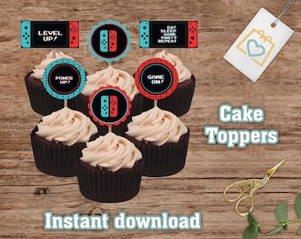 May include: Set of 6 cake toppers featuring a video game theme. The toppers are printed on cardstock and have a variety of designs, including a controller, a level up sign, and a game on sign. The toppers are perfect for a video game themed birthday party.