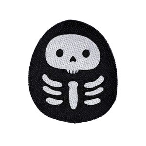 May include: Black and white embroidered patch of a skeleton with a skull and crossbones. The skeleton is inside a black oval shape.