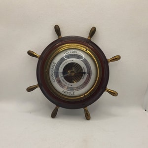 German JG Gischard Aneroid Ships Wheel Barometer made of wood, brass, metal, and glass