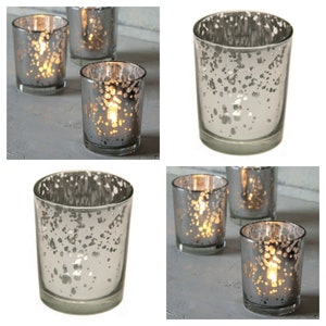 May include: Set of five silver votive candle holders with a speckled finish. The candle holders are made of glass and have a round shape.