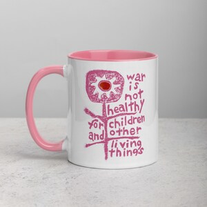 War is not Healthy for Children and other Living Things, Mug with pink print and color Inside