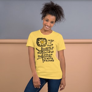 War is not healthy for Children and other living things. Bella Canvas 3001 Short-Sleeve Unisex T-Shirt in yellow, pink, blue, orange