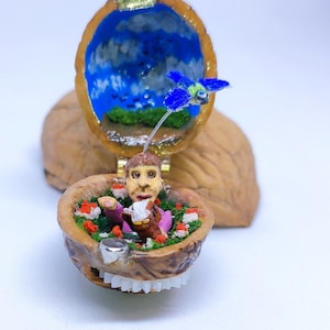 Miniature automaton: man, book, bird.