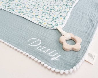 Organic daisy baby comforter & wooden teether gift for baby girl. Personalised pacifier blanket made from soft organic muslin.