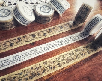 May include: Assortment of decorative washi tapes with a vintage aesthetic. The tapes feature a variety of designs, including a skull, a skeleton, and a handwritten script. The tapes are rolled up and ready to be used for crafting, scrapbooking, or decorating.