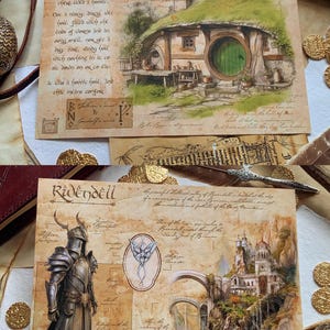 May include: Two illustrated postcards featuring scenes from the Lord of the Rings. The first postcard shows a hobbit hole with a green door and the text "Hobbicon". The second postcard shows a castle on a cliff with a river and the text "Ridendell".