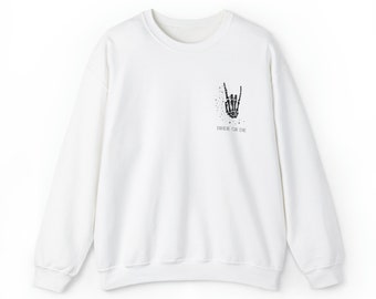 May include: White long-sleeve sweatshirt with a black skeleton hand making a rock and roll sign and the text "Ride or Die" printed on the front.