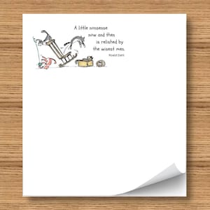 May include: White paper with a quote by Roald Dahl and a whimsical illustration of cats. The quote reads, "A little nonsense now and then is relished by the wisest men." The paper has a curled corner.