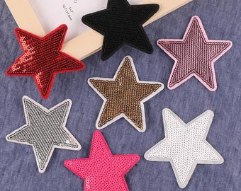 May include: Seven star-shaped iron-on patches in various colors, including red, pink, black, gold, silver, and white. The patches are made of sequins and are perfect for adding a touch of sparkle to clothing, bags, or other accessories.