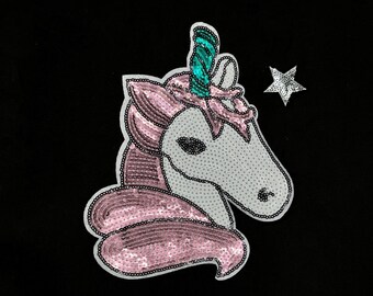 May include: A pink and white sequined unicorn head with a teal horn and a silver star above it.