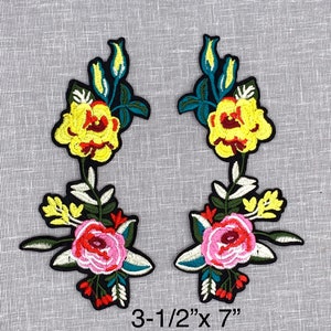 May include: Two embroidered floral patches with yellow, pink, red, and green flowers. The patches are 3-1/2 inches by 7 inches.