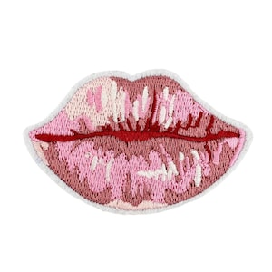 May include: Pink and red embroidered patch of a pair of lips.