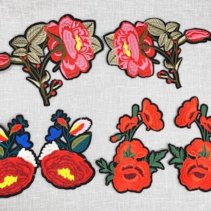 May include: Assortment of embroidered flower patches in various colors and styles. The patches feature roses, poppies, and other floral designs.