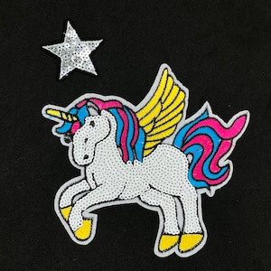 May include: A white unicorn with a pink and blue mane and tail, yellow wings, and a gold horn. The unicorn is standing on a black background with a silver star.