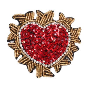 May include: A red heart-shaped beaded applique with gold and silver beads. The heart is surrounded by a gold beaded frame.