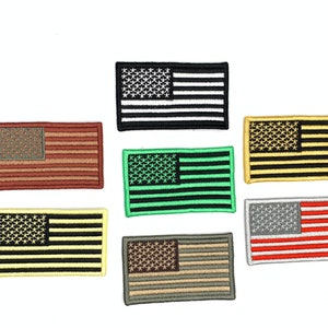 May include: Set of ten embroidered American flag patches in various colors, including black, white, red, green, yellow, and brown.