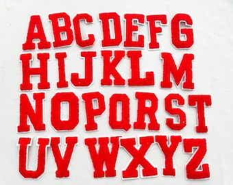 May include: Red felt alphabet letters with white outlines. The letters are in uppercase and are arranged in alphabetical order.