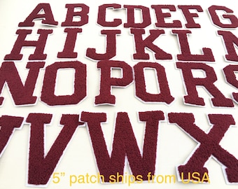 May include: A set of 26 burgundy felt letters, each measuring 5 inches tall, representing the English alphabet. The letters are individually cut out and have a white outline.
