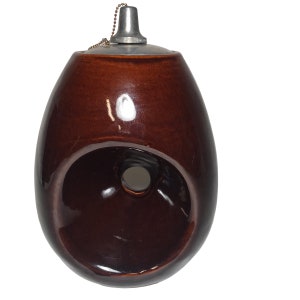 May include: A brown ceramic oil lamp with a metal lid and a chain. The lamp has a hole in the side for the wick.