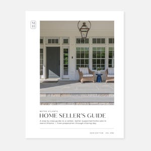 May include: A white document cover titled Metro Atlanta Home Seller's Guide 2026 Edition Vol One. The cover features a photograph of a house exterior with a dark gray door, white window frames, two wicker chairs, and a blue side table on a stone porch.
