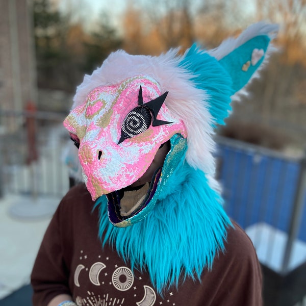 pink and teal fursuit dino mask