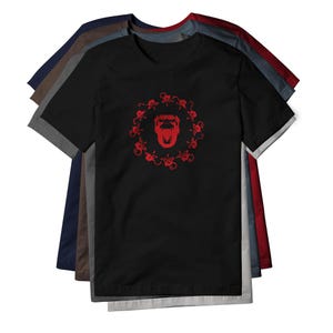 May include: A stack of short-sleeved t-shirts in various colors including black, navy, brown, gray, and red. The top black t-shirt features a central red graphic of a roaring gorilla head surrounded by a circular pattern of small monkey silhouettes.