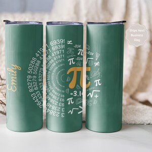 May include: Three green insulated tumblers. One tumbler has the name "Emily" in gold script. The center tumbler features a Pi symbol with mathematical symbols and numbers. The third tumbler is plain green. The tumblers are approximately 8 inches tall.