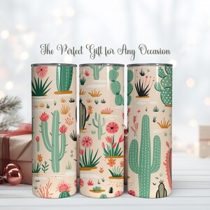 May include: Three cylindrical tumblers featuring a repeating pattern of green cacti and pink flowers on a light beige background. The text "The Perfect Gift for Any Occasion" is printed in a cursive script above the tumblers.