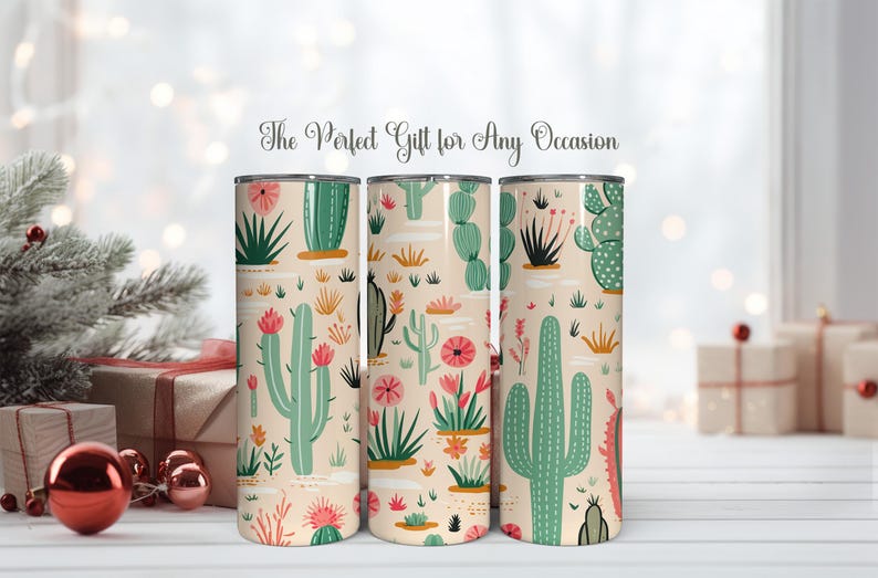 May include: Three cylindrical tumblers featuring a repeating pattern of green cacti and pink flowers on a light beige background. The text "The Perfect Gift for Any Occasion" is printed in a cursive script above the tumblers.