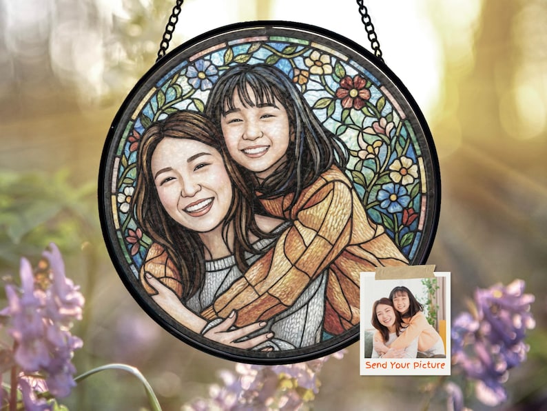 May include: Round stained glass art piece featuring a portrait of two smiling people embracing. The artwork is framed in black and includes floral and geometric patterns in various colors. A small photo with the text "Send Your Picture" is attached.