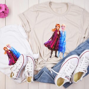 May include: A set of three ceramic mugs with a speckled, matte finish. The mugs are in shades of cream, light gray, and dark gray. Each mug has a simple, minimalist design and a rounded handle.