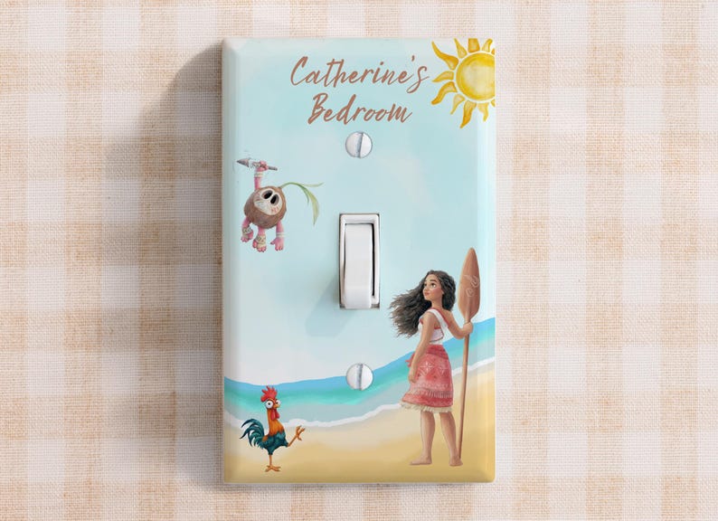 May include: A rectangular light switch cover featuring a light blue sky, a yellow sun, and a beach scene with a character holding a wooden oar, a small rooster, and a coconut creature. The text Catherine's Bedroom is printed in brown script.