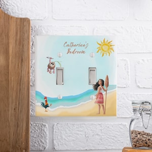May include: A double light switch cover featuring a beach scene with a cartoon girl holding a wooden oar, a rooster, and a small creature hanging from a vine. The text Catherine's Bedroom is printed at the top with a yellow sun illustration.