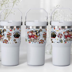 May include: A set of three ceramic mugs with a speckled, matte finish. The mugs are in shades of cream, light gray, and dark gray. Each mug has a simple, minimalist design, perfect for coffee or tea.