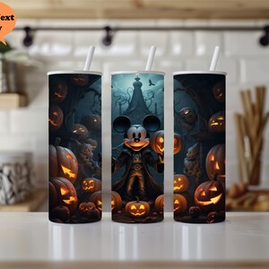 May include: Three black and white Halloween themed tumblers with Mickey Mouse dressed as a vampire holding a pumpkin. The tumblers feature a dark background with pumpkins and spooky trees.