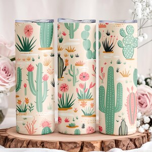 May include: Three cylindrical tumblers with a light beige background featuring a repeating pattern of various green cacti and succulents in shades of sage and emerald, accented with small pink and orange desert flowers and subtle white brushstrokes.