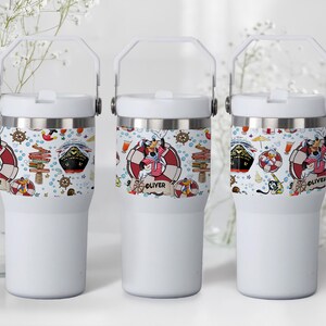 May include: Three white insulated tumblers with a nautical-themed design. The design includes cartoon characters, ships, life preservers, and the name "Oliver". Each tumbler has a white handle and lid.