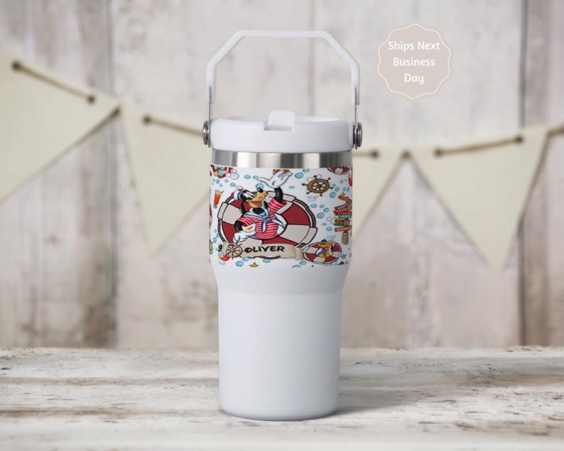 May include: A white ceramic mug with a black handle and the text "But First, Coffee" in a black, bold font. The mug is on a white surface.