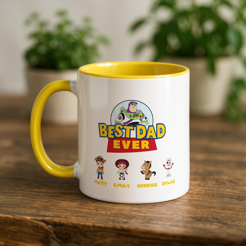May include: A white ceramic mug with a yellow interior and handle. The front features a graphic of Buzz Lightyear above the text BEST DAD EVER. Below are four cartoon characters with the names Matt, Emily, Georgie, and Dylan printed underneath.