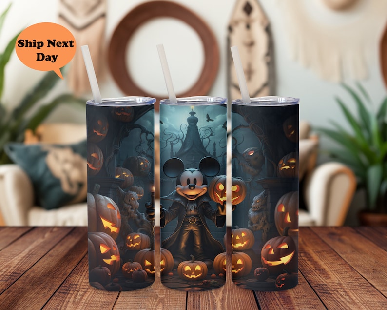 May include: A set of three stainless steel tumblers with a Halloween theme featuring Mickey Mouse dressed as a vampire. The tumblers are decorated with jack-o'-lanterns and other Halloween imagery.
