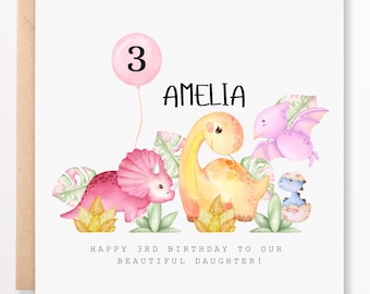 May include: A pink and white birthday card with a dinosaur theme. The card features a pink balloon with the number 3, a pink dinosaur, a yellow dinosaur, a pink flying dinosaur, and a blue dinosaur. The card says "Happy 3rd Birthday to our beautiful daughter!" and "Amelia".