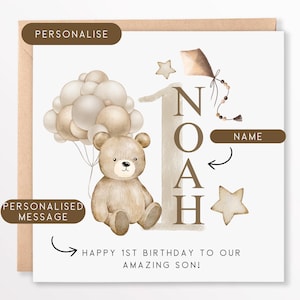 May include: A personalized 1st birthday card with a brown teddy bear holding balloons, a kite, and stars. The card says "Happy 1st Birthday to our amazing son!" and has a space to add a name.
