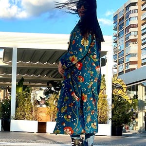 A kimono-style coat made from printed cotton velvet is a sophisticated and unique garment that blends elegance and comfort.