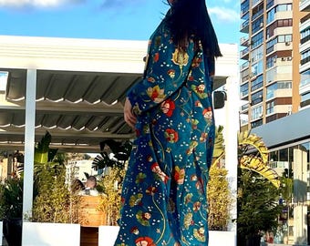 A kimono-style coat made from printed cotton velvet is a sophisticated and unique garment that blends elegance and comfort.